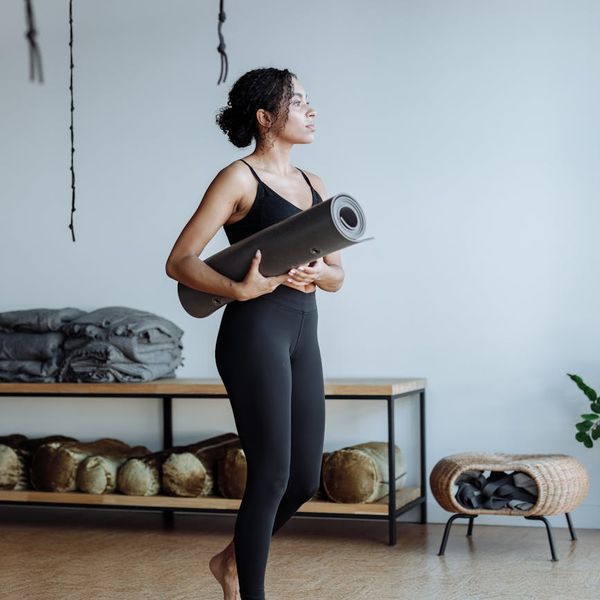 Person holding a balanced yoga pose, symbolizing stability and calm.